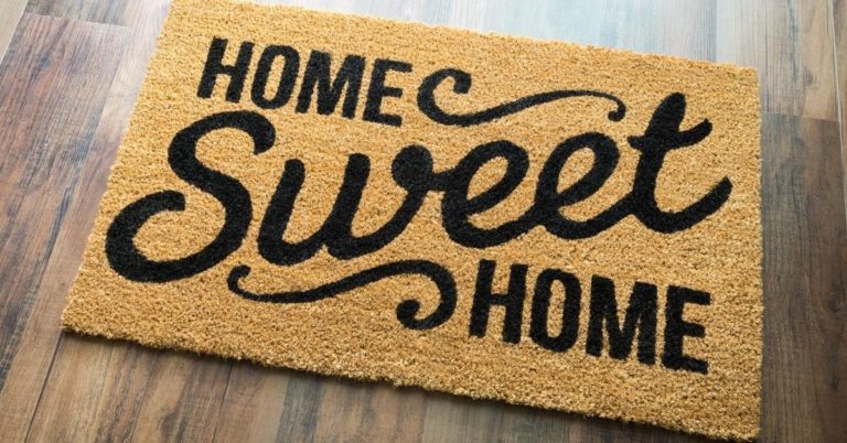 Buying a House vs. Renting - picture of Home Sweet Home welcome mat