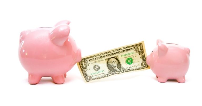 CIT Bank Savings Builder vs. Traditional Savings Accounts - CIT Bank Savings Builder vs Traditional Savings Accounts Pin - picture of big piggy bank and little piggy bank pulling at dollar bill