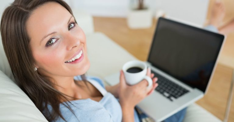 Dos and Don'ts of Personal Loan - picture of woman with her laptop holding coffee