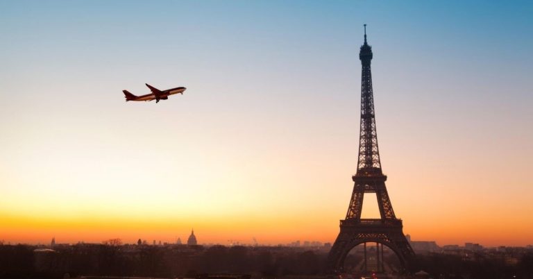 Europe for Cheap - picture of Eiffel Tower with plane in sky