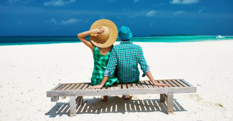 Give Yourself a Raise - picture of back of couple sitting at beach