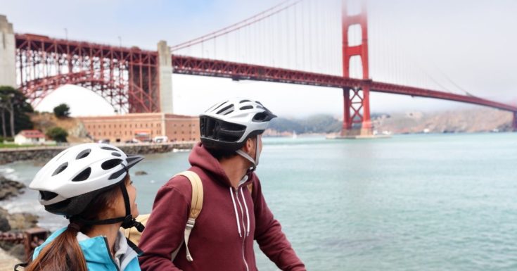 picture of bicyclists looking at Golden Gate Bridge