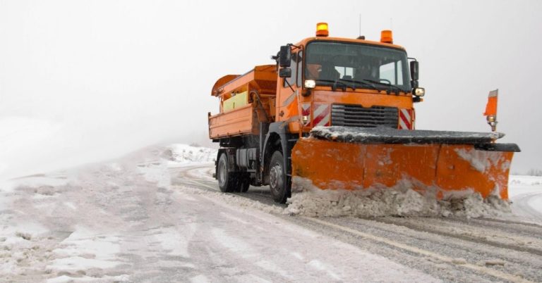 How Snowpocalypse Cost Us Almost $1,500 - picture of orange truck plowing snow from road