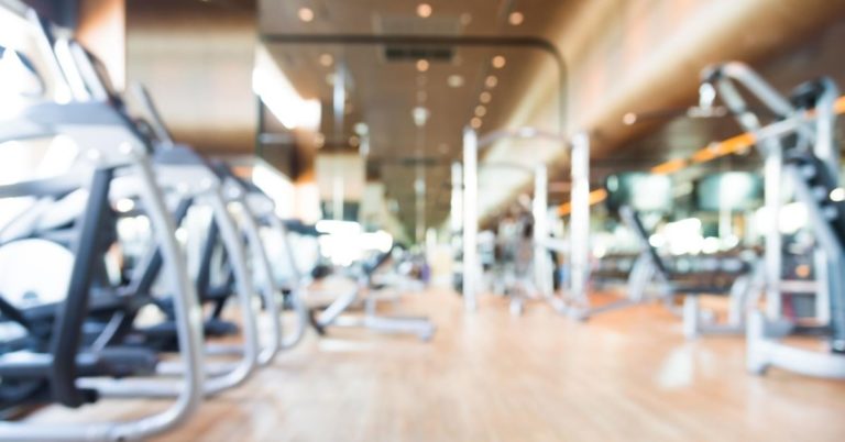 My Biggest Financial Regrets - blurred out picture of a membership gym room