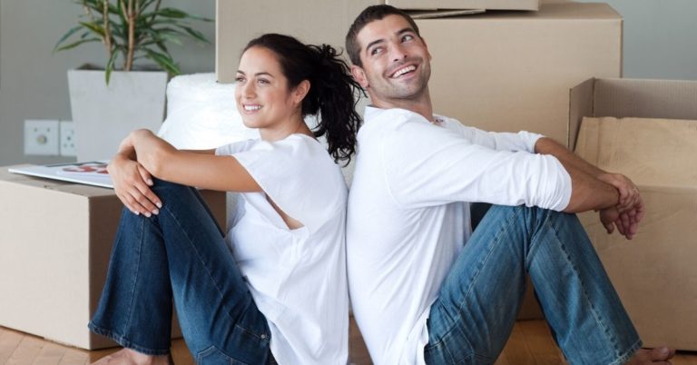 NASB High Rate Savings Review - picture of couple on floor in empty house with boxes around them