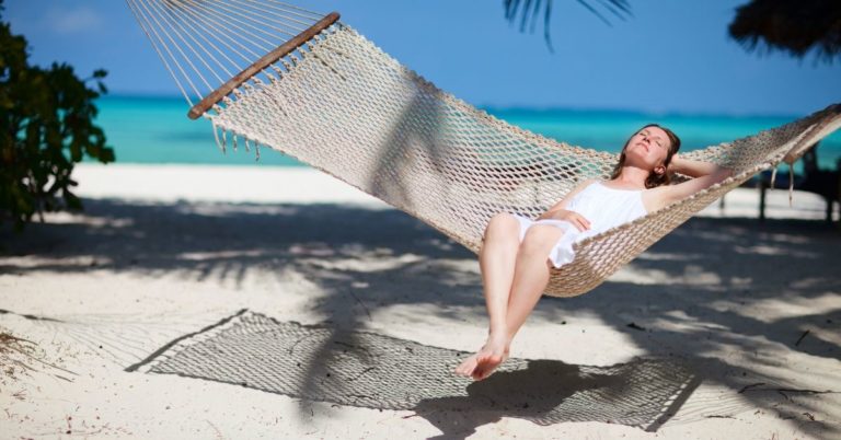 Saving For My Dream Goal - picture of woman relaxing in hammock at tropical beach