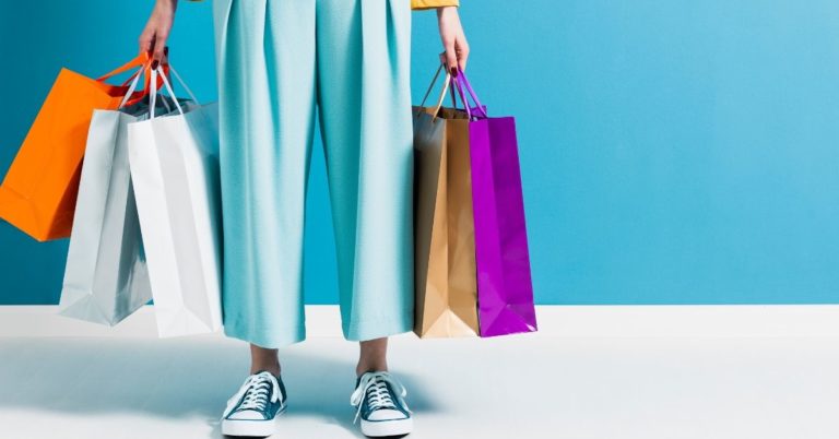 Spend with Purpose - picture of someone holding lots of shopping bags