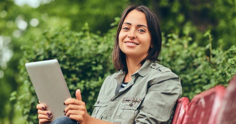 Springboard America Review - picture of woman holding tablet and smiling