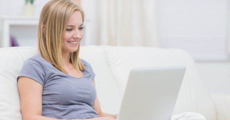 Survey Club Review - picture of woman on couch with laptop