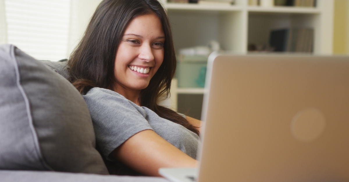 Swagbucks Review - picture of woman smiling at her laptop