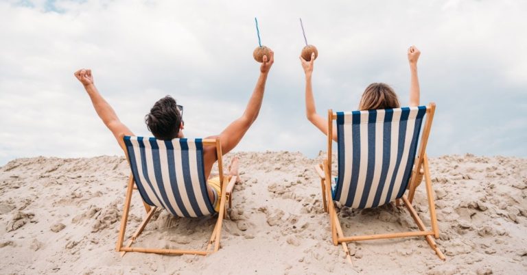 Tiller Review - picture of back of couple in beach chairs with arms raised