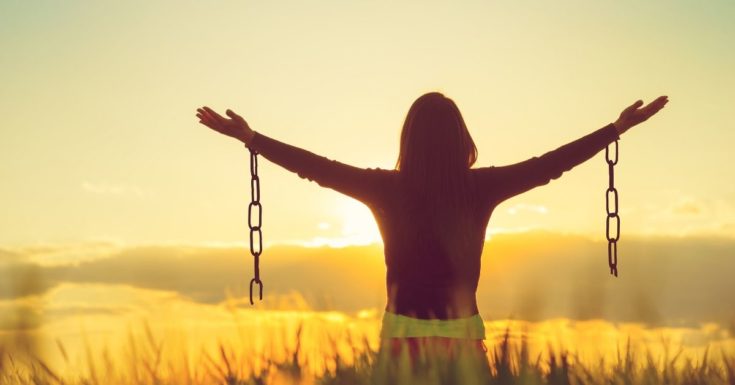 Truths for Destroying Debt - picture of woman in field with broken chains