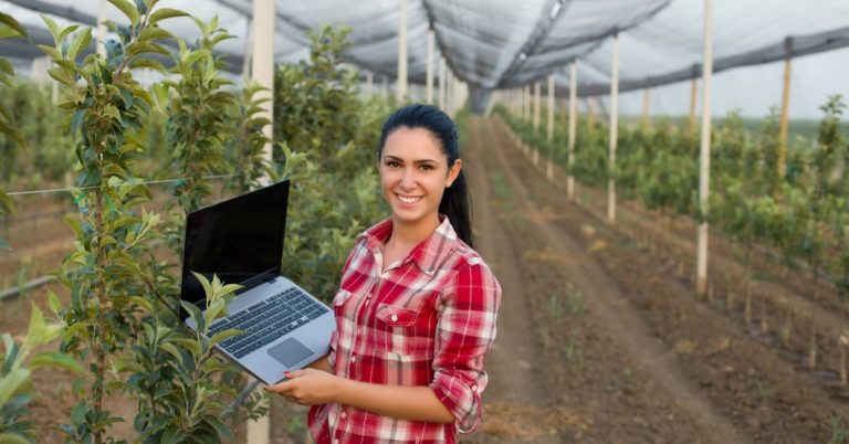 What is PSLF - picture of woman agronomist holding laptop in greenhouse