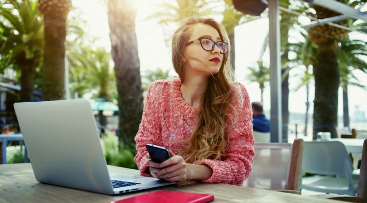 Image of young woman completing work from home jobs on her computer