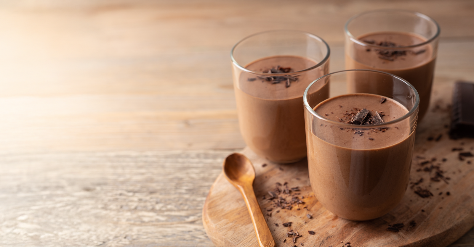 Chocolate drink in a glass with chocolate pieces