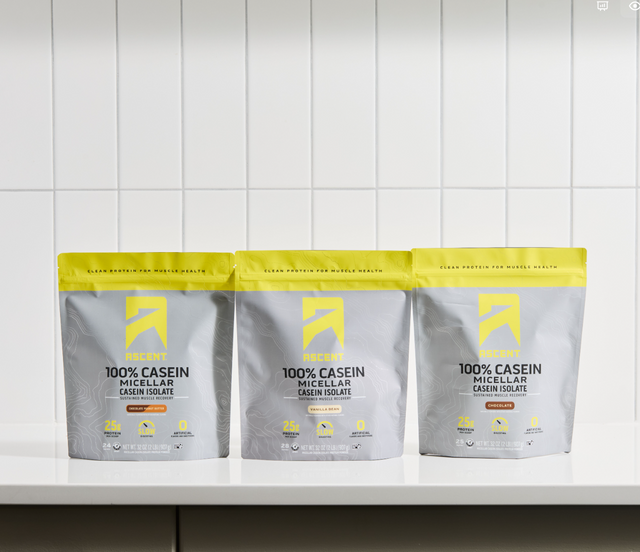 Three packages of 100% Casein Micellar Crean Isolate on a white background
